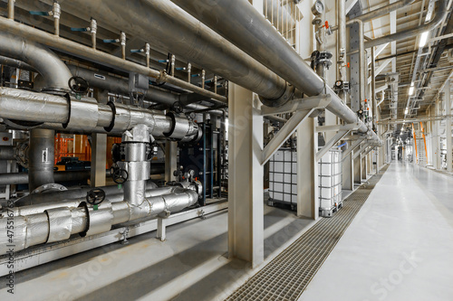 Photo of pipes and tanks. Chemistry and medicine production. Pharmaceutical factory. Interior of a high-tech factory, modern production
