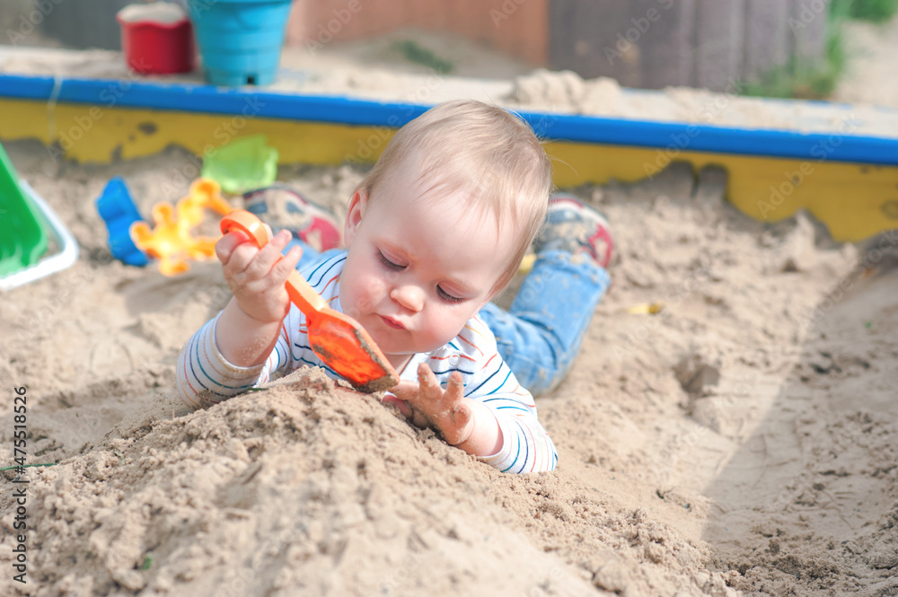 Toddler activity on playground in sandbox.. Toddler activity on playground in sandbox..