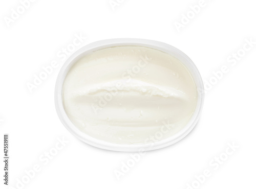 Plastic container of tasty cream cheese isolated on white, top view