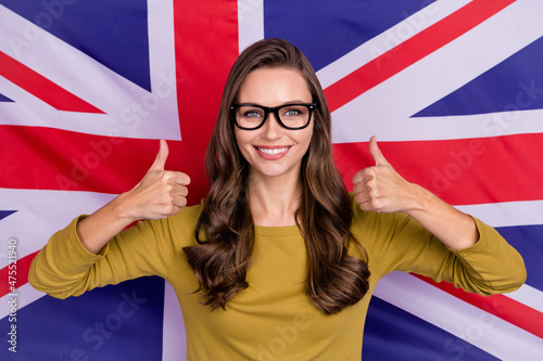 Portrait of cheerful attractive person two hands show thumbs up isolated on british flag background