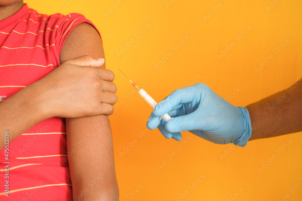 doctor hand in medical gloves holding syringe.