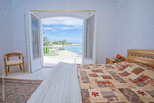 Interior design of bedroom in house with sea view
