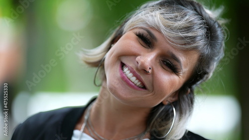 Young woman portrait smiling at camera. 30s person close-up face smile