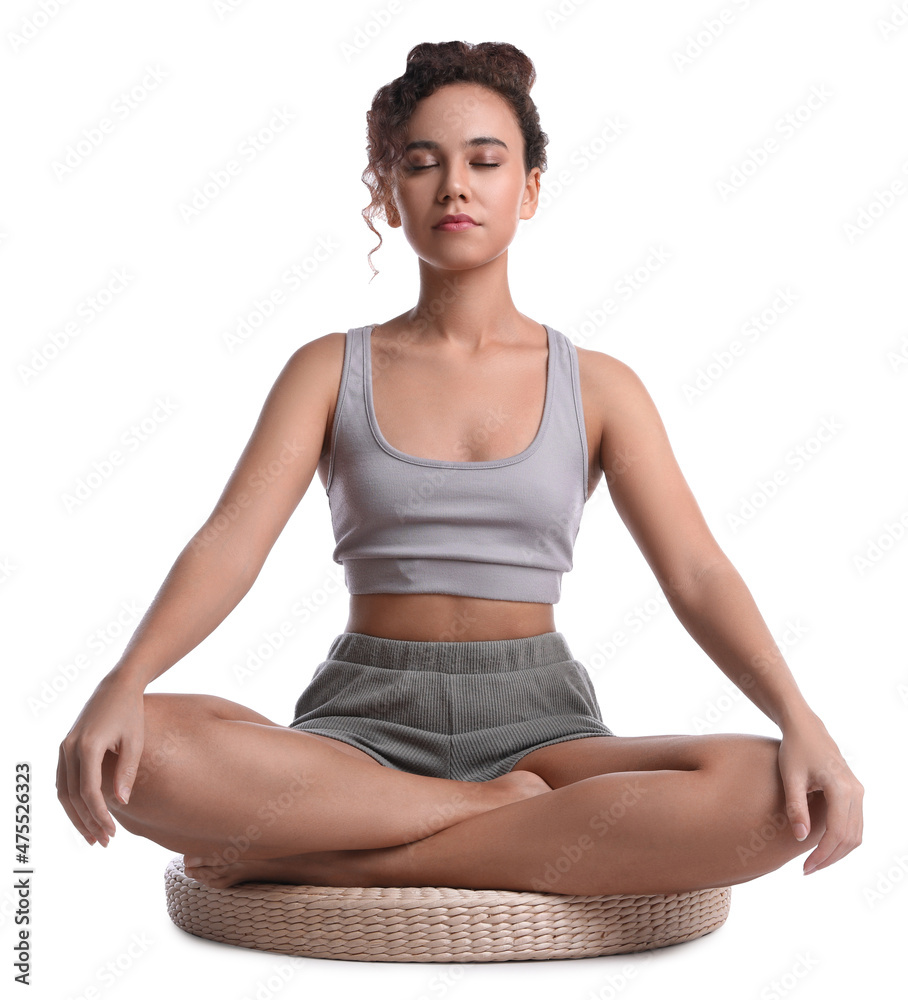 Beautiful African-American woman meditating on white background Beautiful African-American woman meditating on white background