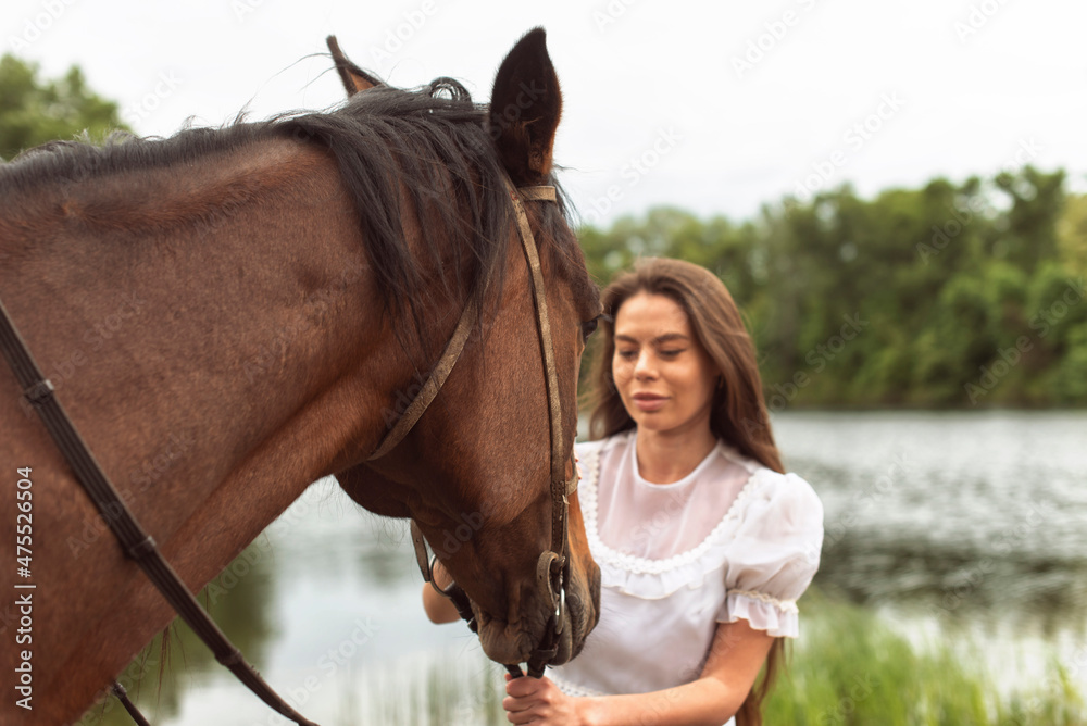 Obraz premium Walk with a horse near the river