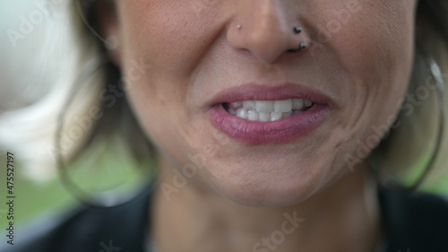 Woman mouth speaking to camera. Girl lips close-up lips talking photo