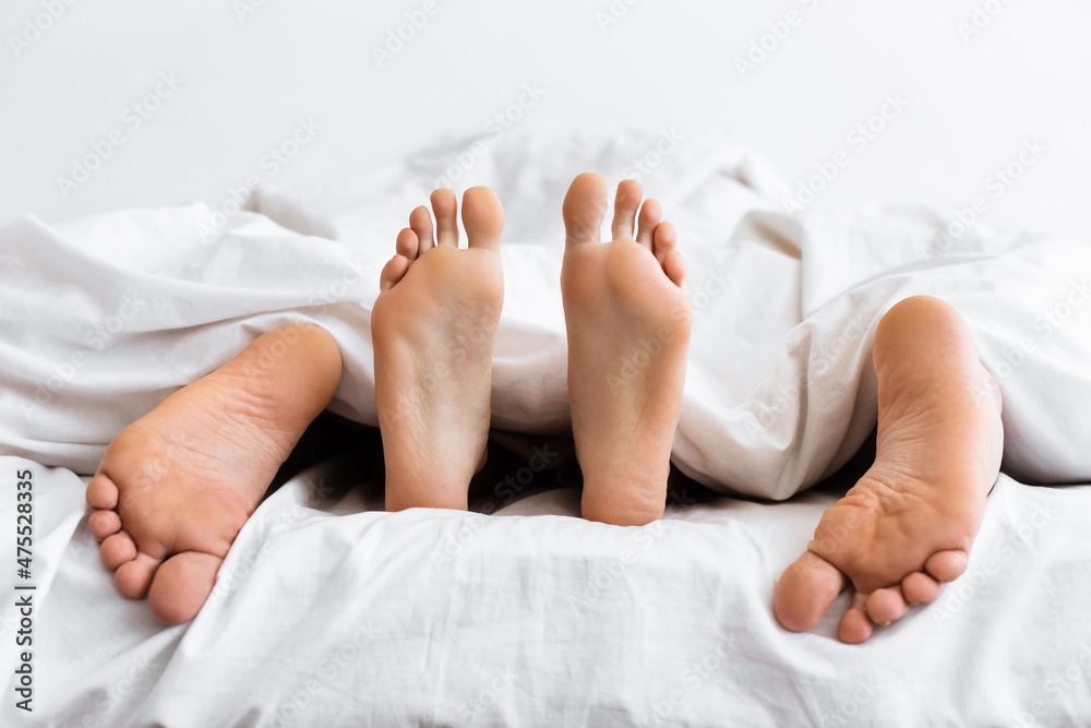 Married Couple Having Sex Lying Under Blanket In Bed Indoor Stock Photo Adobe Stock pic