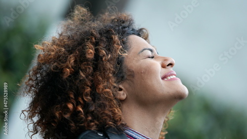 Tableau sur toile Successful black woman celebrating achievement closing eyes feeling relief