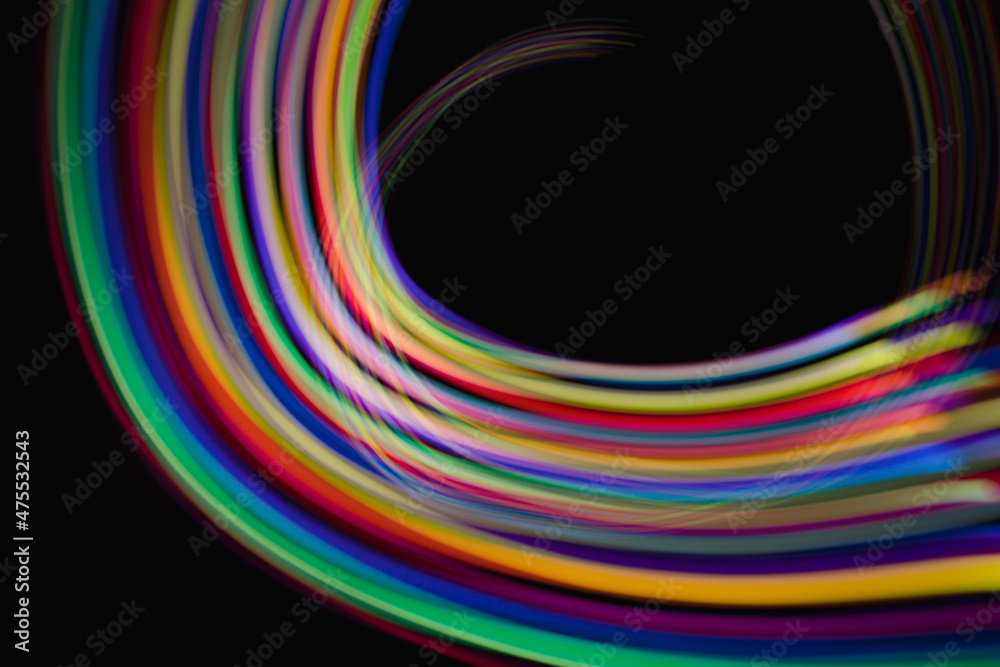 Blurred light rainbow lines. Colored streaks of light. Blurred light rainbow lines. Colored streaks of light.