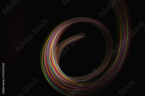 Blurred light rainbow lines. Colored streaks of light.