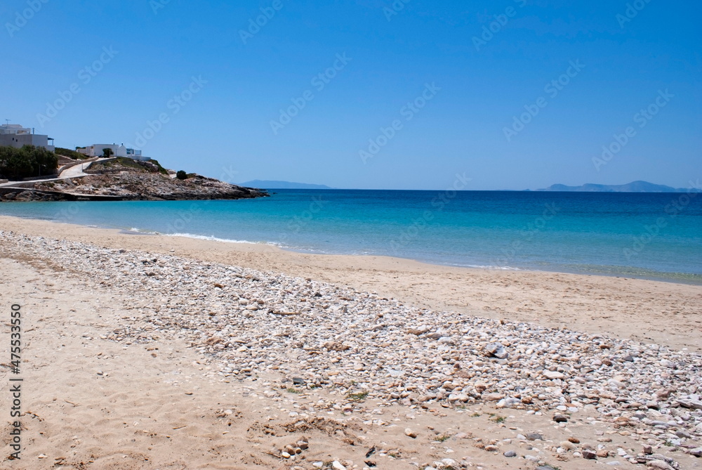 Beautiful sandy beach, Donousa island, Cyclades, Greece. A secluded destination with soft sand on a summer day.  Landscape aspect shot.