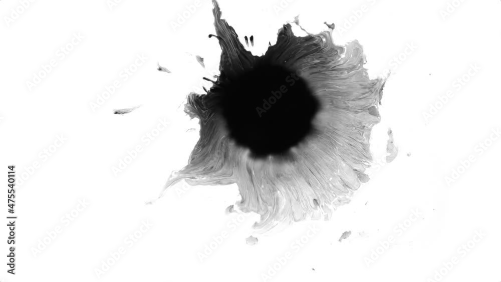 Black ink slowly expanding on white background. White backdrop can be removed with 