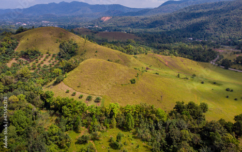 Obraz na płótnie bald mountain or Phu Khao Ya with green grass field and blue sky. One of natural travel attraction in Ranong province, Thailand w salonie