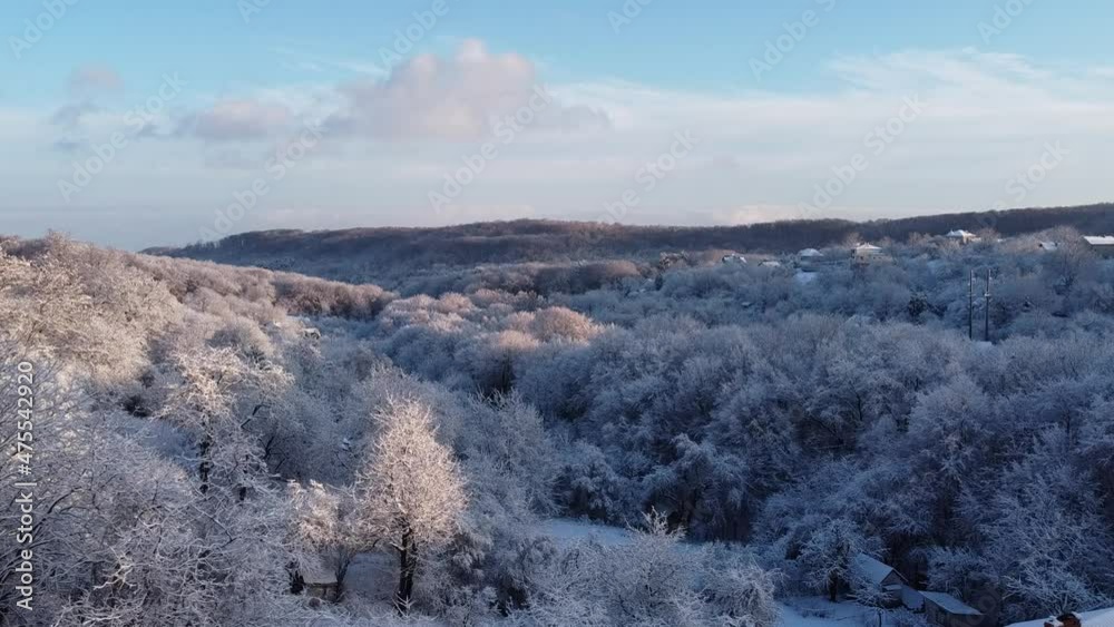 Aerial view of a drone flying over the winter forest. Aerial view of a drone flying over the winter forest.