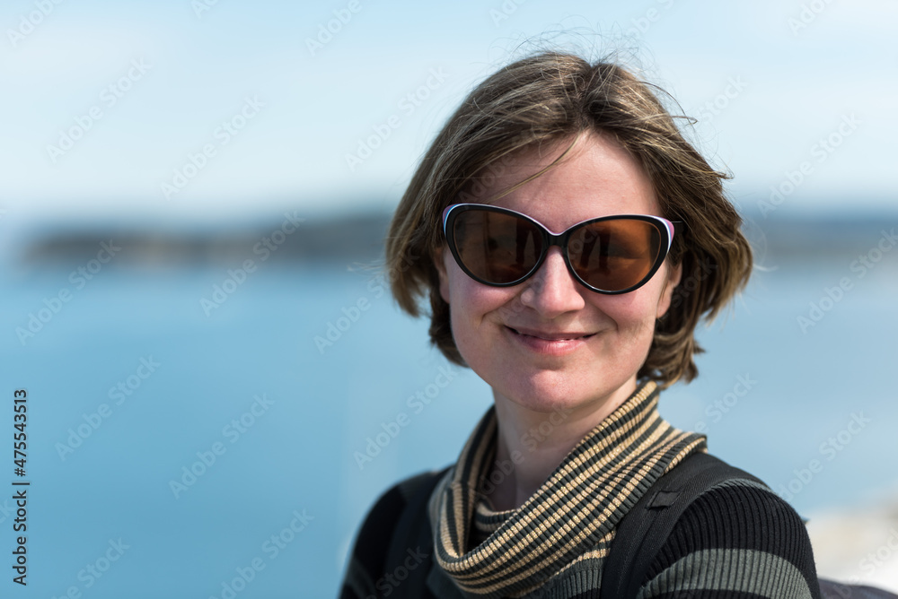 Holiday portrait of a smiling 30 year old white woman at the seaside, Piran, Slovenia Holiday portrait of a smiling 30 year old white woman at the seaside, Piran, Slovenia