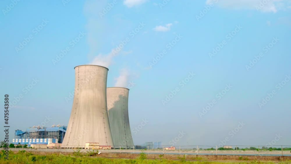 Thermal power plant with steaming cooling towers Thermal power plant with steaming cooling towers