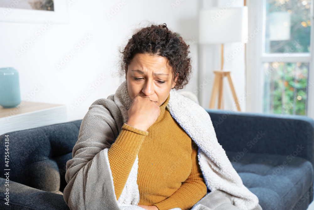 Anxious woman is suffering cold at home Stock 写真 Adobe Stock