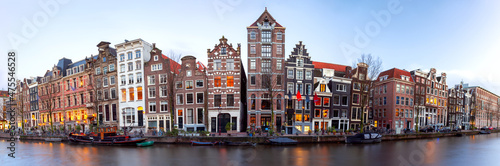 Panorama of the city waterfront of Amsterdam at sunset.