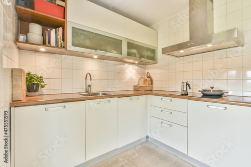 Wallpaper Mural Kitchen interior with wooden counter and white cabinets Torontodigital.ca