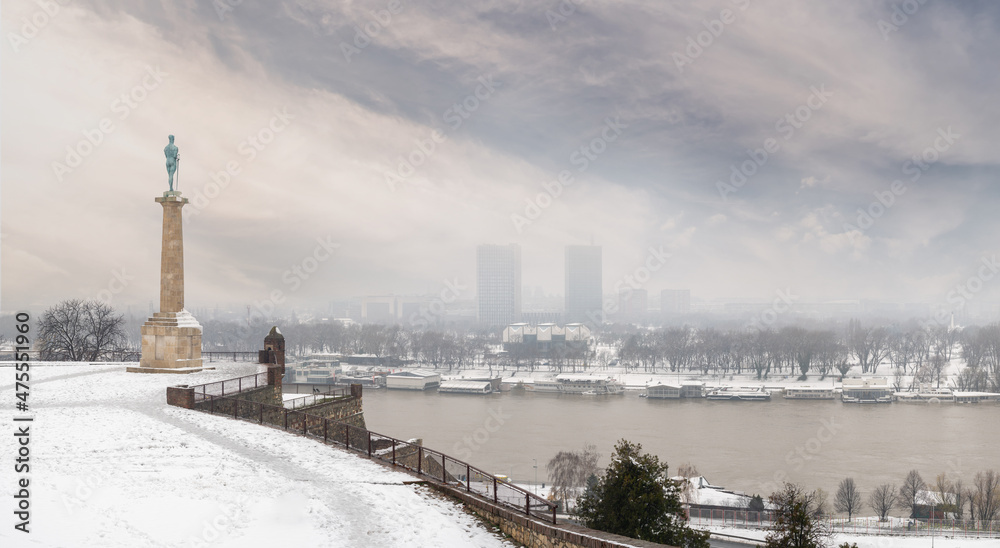Winter panorama of Belgrade Kalemegdan fortress Sava rivers confluence and New Belgrade by day with snow