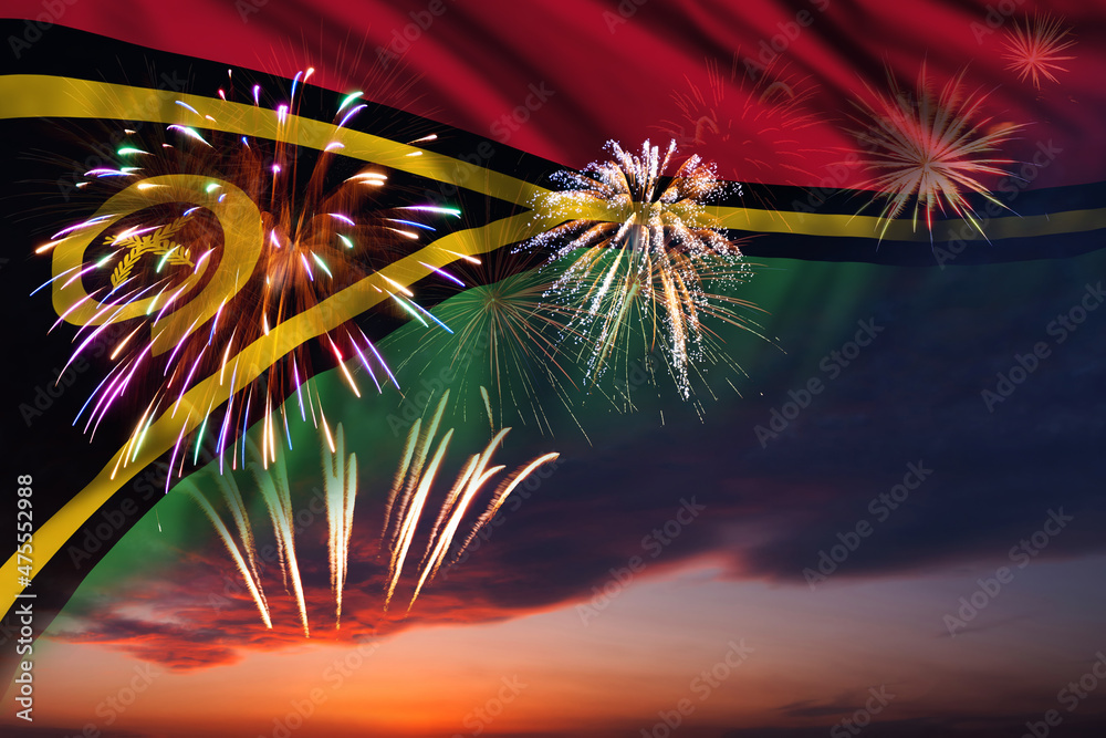 Fireworks in evening sky and flag of Vanuatu