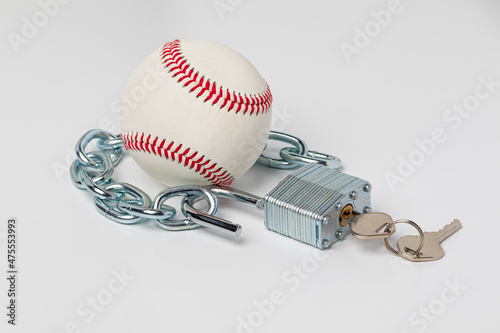 Baseball with chain and open lock. Baseball strike, lockout and labor agreement concept.  photo