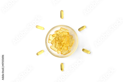 Vitamin D capsules in form of sun isolated on white background.