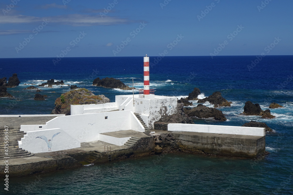 Porto Velho harbour with its white quay and the red and white beacon on a sunny summer day (horizontal image), Santa Cruz das Flores, Flores, Azores, Portugal