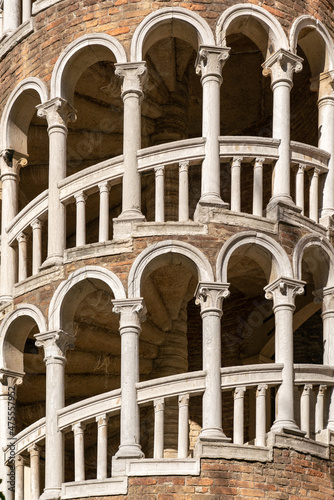 Spiral staircase with round renaissance arches and marble balustrade in Venice photo