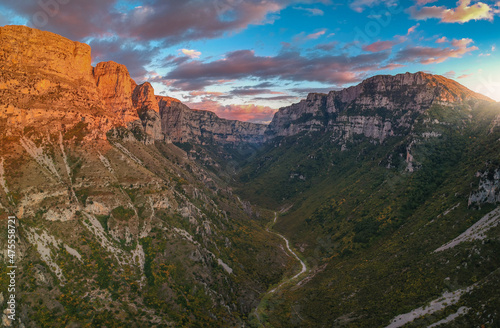 Aerial panoramic view of the impressive Vikos gorge in the Zagoria region at Pindus Mountains of northern Greece. It lies on the southern slopes of Mount Tymfi and it is the the deepest in Europe.
