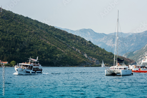 Bay of Kotor, view from the sea to the boats near old town of Herceg Novi in Montenegro, Europe, Adriatic Sea and mountains © Inna