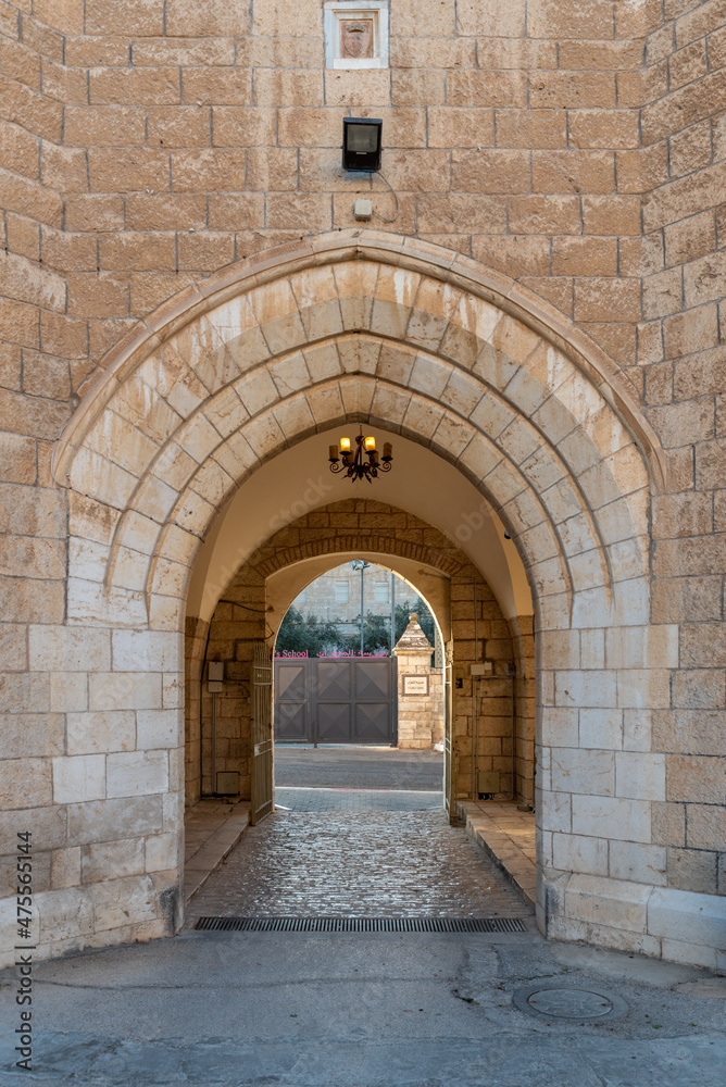 Arched entrance to the courtyard of Saint George's Cathedral in Jerusalem Israel
