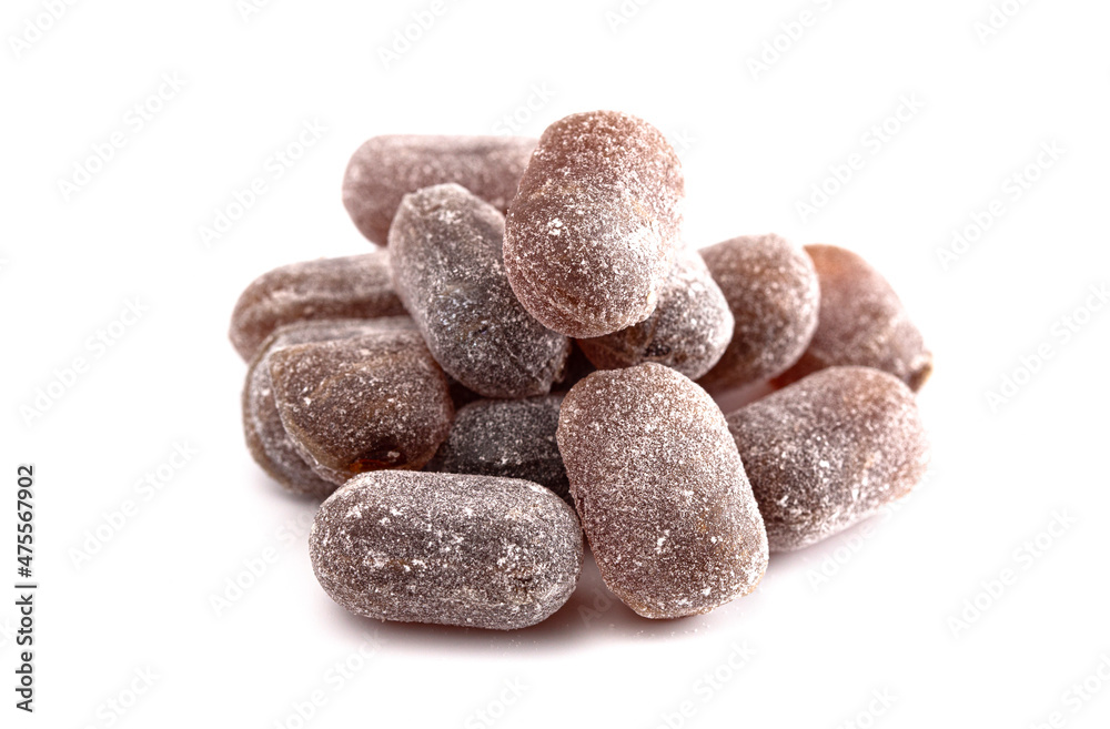 Rounded Brown Old Fashioned Hard Candies on a White Background Rounded Brown Old Fashioned Hard Candies on a White Background