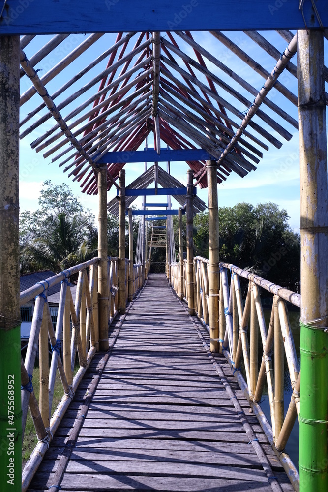 Bamboo bridge in the mangrove forest area.