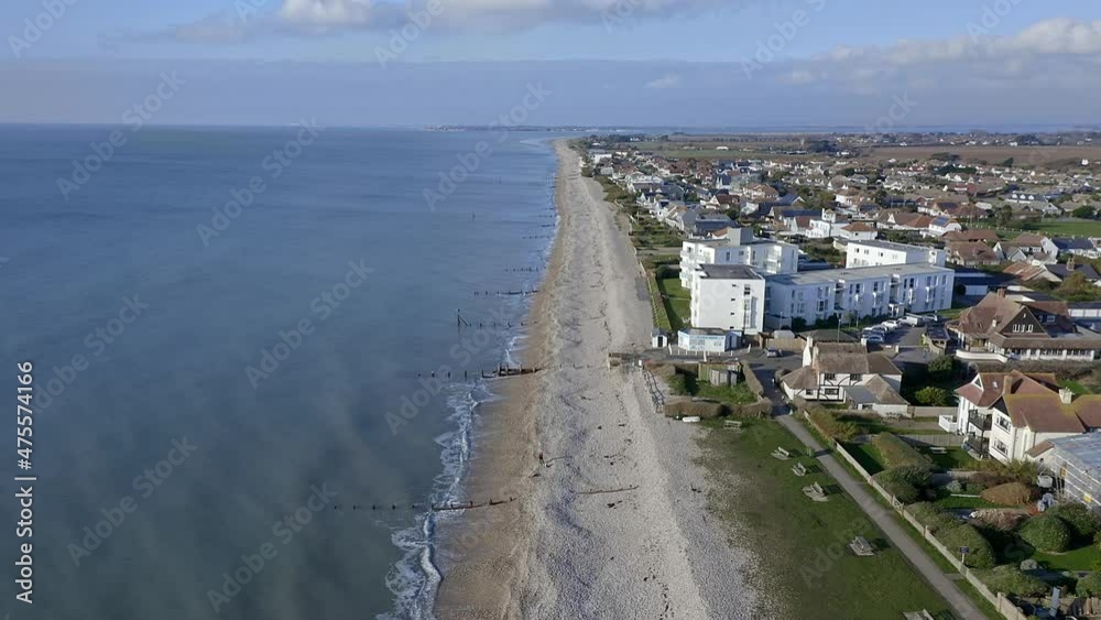East Wittering seafront a popular resort for tourists in the summer and situated in West Sussex Southern England, Aerial video. East Wittering seafront a popular resort for tourists in the summer and situated in West Sussex Southern England, Aerial video.