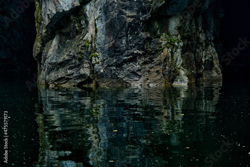 picturesque cave with water in summer