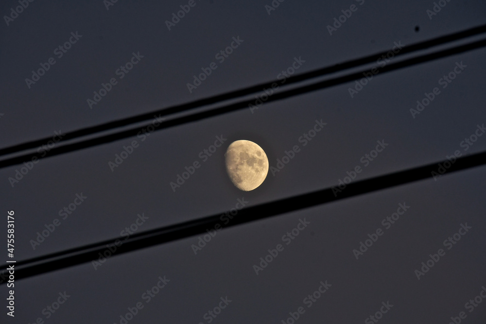 Waxing gibbous Moon through power lines Stock Photo Adobe Stock