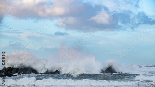 Crushing ocean waves. Scenic sky and tranquil beach line