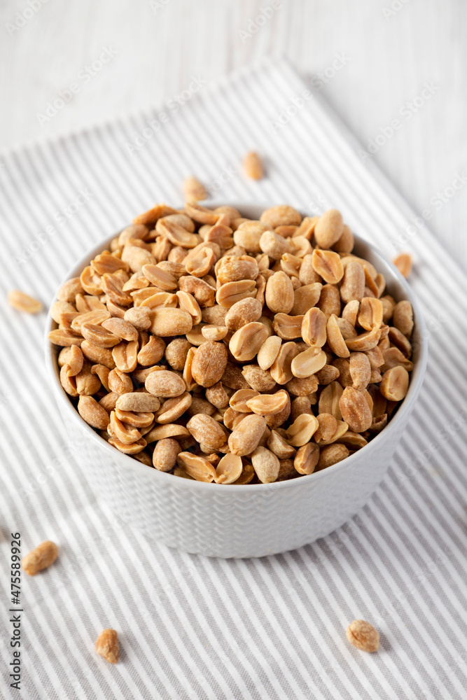 Roasted Salted Shelled Peanuts in a Gray Bowl, side view.