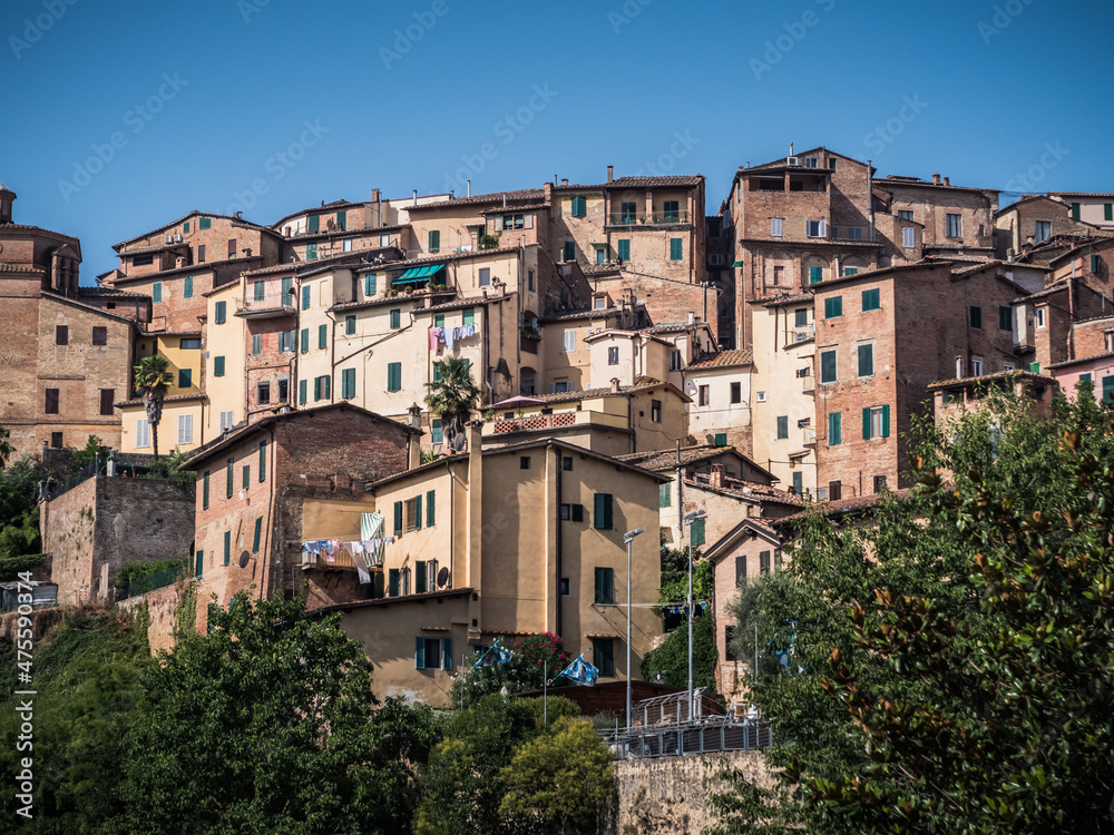 Siena Cityscape with Medieval Residential Houses of the Historic Old Town Center Perched on a Hill in Tuscany