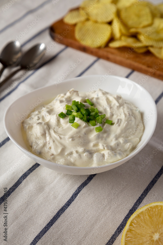 Homemade Clam Dip with Potato Chips, side view. Homemade Clam Dip with Potato Chips, side view.