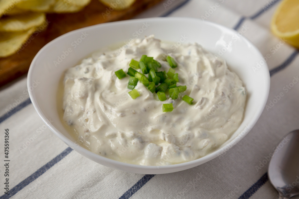 Homemade Clam Dip with Potato Chips, side view. Close-up. Homemade Clam Dip with Potato Chips, side view. Close-up.