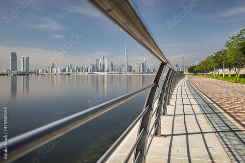 Quadro su tela Midday shot in Dubai showing the skyline on calm waters and railings