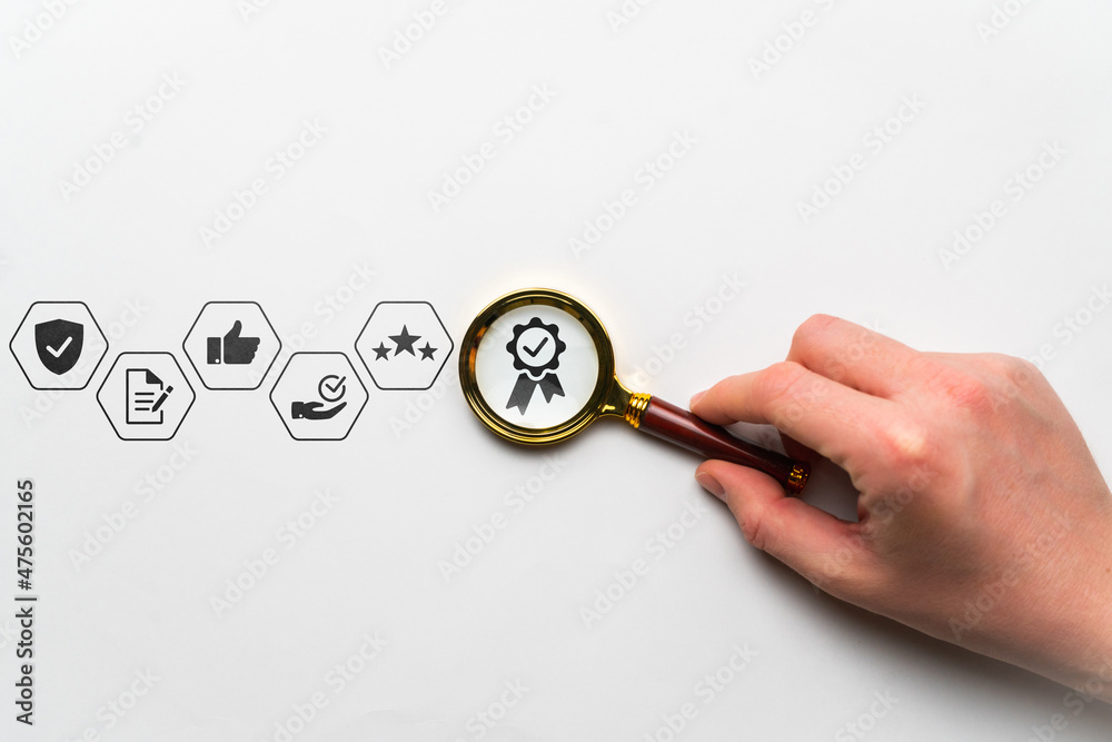 Quality research concept with thematic icons. Hand holds a magnifying glass.