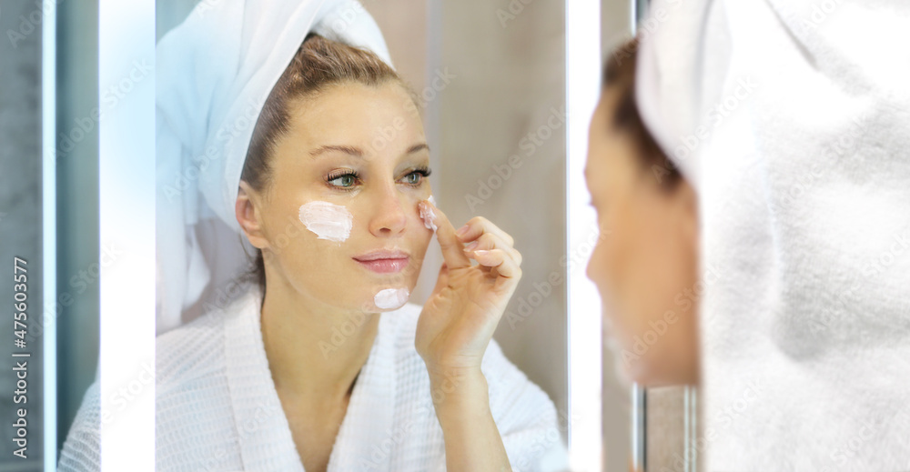 Magic anti-aging cream.Applying the cream. Magic anti-aging cream.Applying the cream.