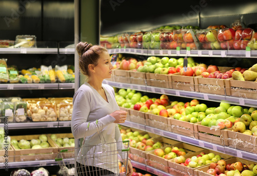 Woman buying fruits at the market