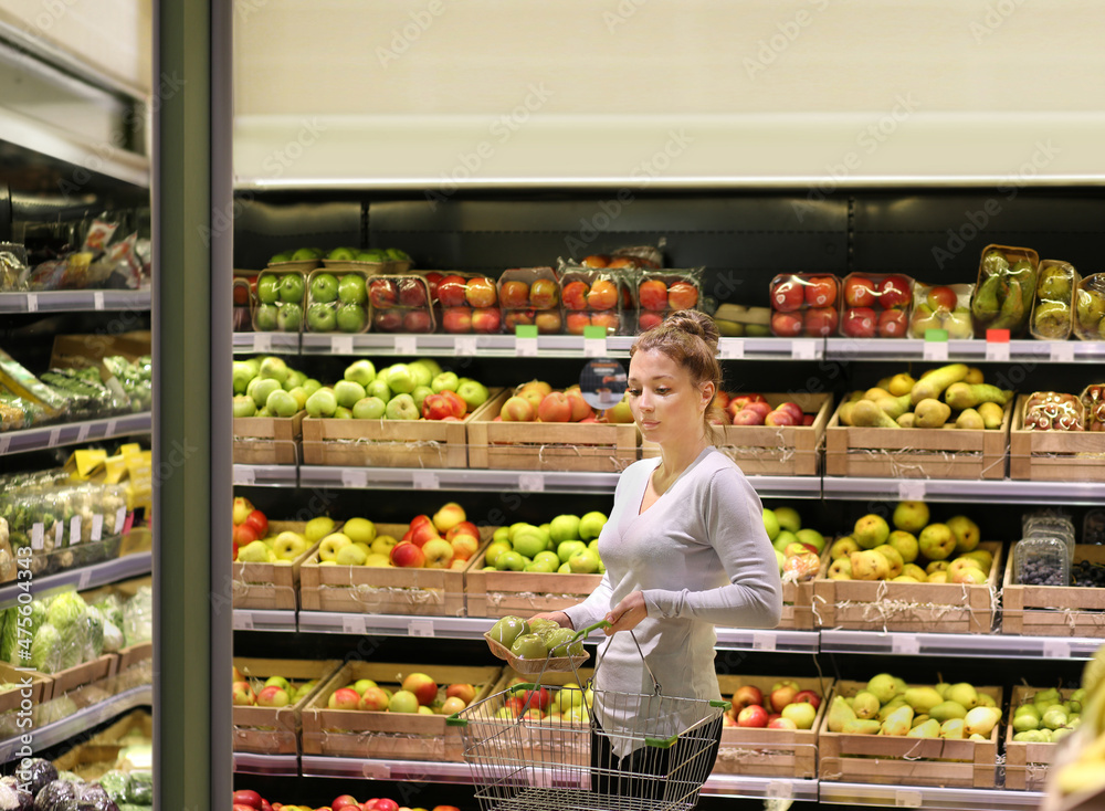 Woman buying fruits at the market