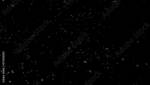 Gold sparkled carnival confetti on black background