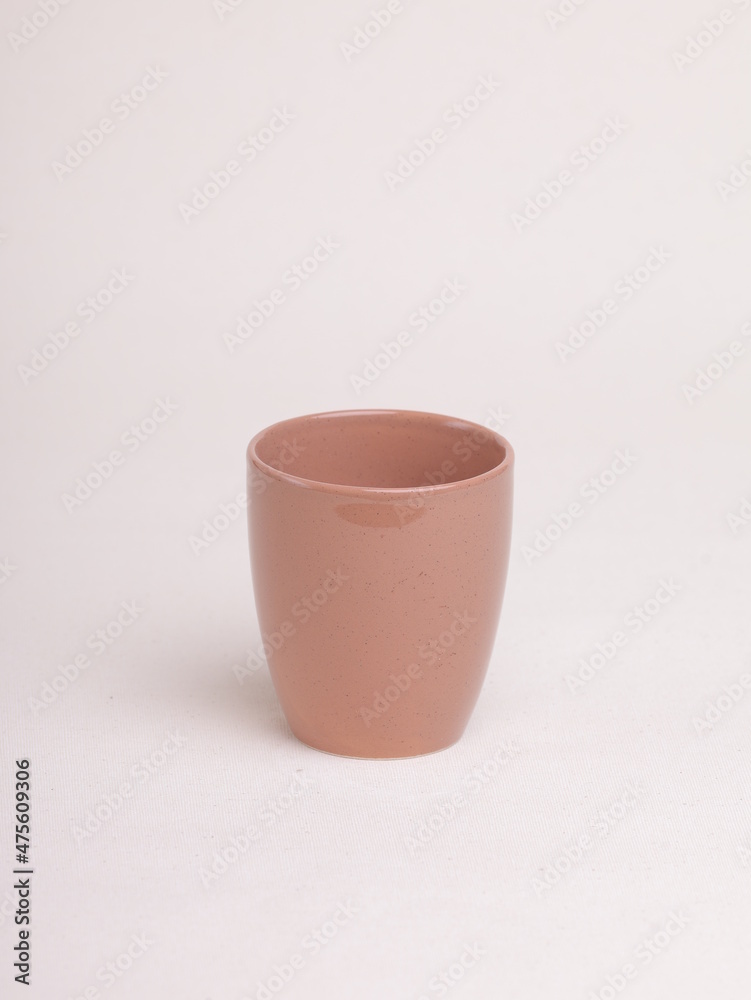 orange tea cup on a light background orange tea cup on a light background
