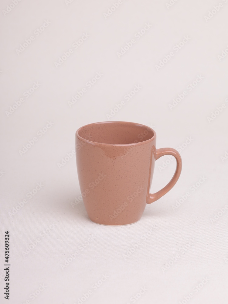 brown ceramic coffee mug on a light background brown ceramic coffee mug on a light background